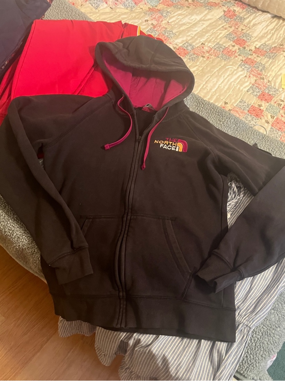 The North Face Black Hoodie with Pink Lining and Logo